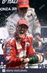 german-ferrari-driver-michael-schumacher-sprays-champagne-on-the-podium-with-second-placed-mik...jpg german-ferrari-driver-michael-schumacher-sprays-champagne-on-the-podium-with-second-placed-mik...jpg