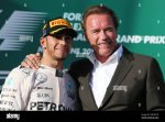 l-to-r-race-winner-lewis-hamilton-gbr-mercedes-amg-f1-on-the-podium-with-arnold-schwarzenegger...jpg